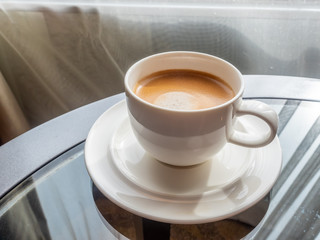 Cup of coffee with window light