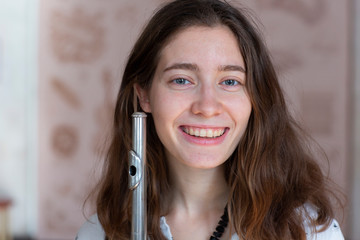 Beautiful young woman with flute Genre portrait of young beautiful girl © biggur