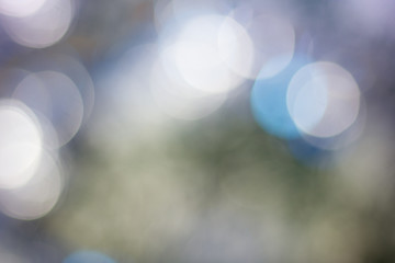 Abstract christmas background, blue colored and blurred.