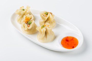 Asian vegetable ravioli on white background