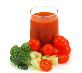Glass of healthy vegetable juice with baby tomatoes, broccoli and celery
