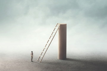 man looking at the top of the tower