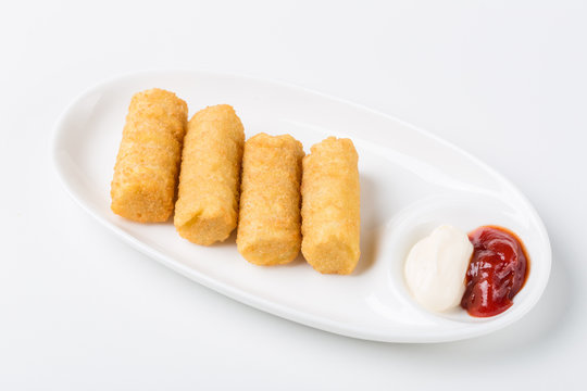 potato croquettes with red souce on white background