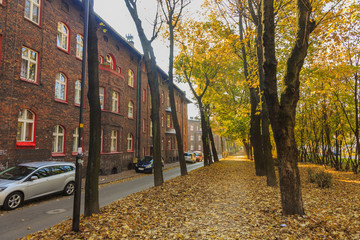 Street in Historic Mining District of Nikiszowiec in Katowice in Polish Silesia. On the left red-brick houses in which the miner's family lived © stepmar