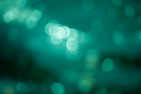 Abstract blurred emerald background with round bokeh, photo