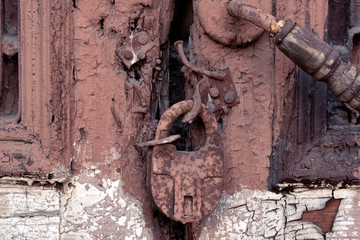 Old rusty padlock on the door