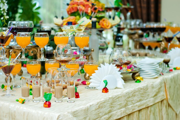 Glass glasses with colored drinks on the table. alcoholic drinks at the buffet