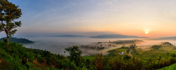 Panorama view sunrise with mist at the mountain