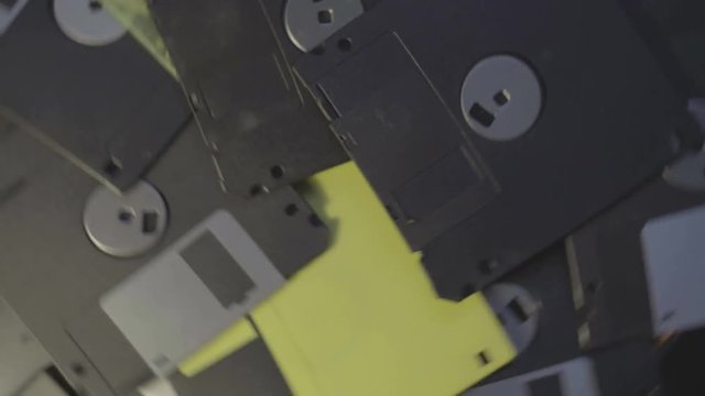 old diskettes data center concept background, pile of floppy discs rotating