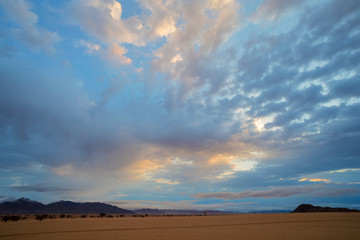 Clouds at sunrise over the desert