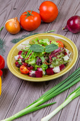 Fresh green salad mix with berries and mint