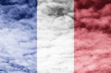 France flag with cloud sky background.