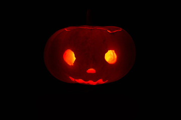 Halloween pumpkin illuminate from inside by candle