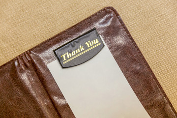 bill in leather book in restaurant - 229211579