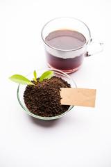 Black Tea Powder or dry dust with or without green leaf and served hot chai in a cup