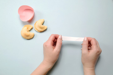 Hand open a fortune cookies with an empty paper