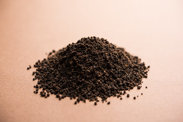 Black Tea Powder or dry dust with or without green leaf and served hot chai in a cup