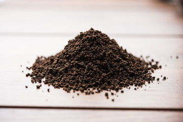 Black Tea Powder or dry dust with or without green leaf and served hot chai in a cup