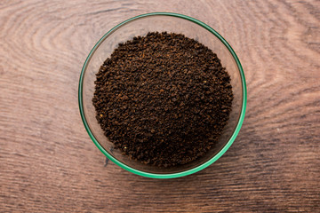 Black Tea Powder or dry dust with or without green leaf and served hot chai in a cup
