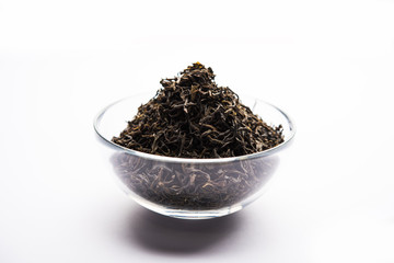 Black Tea Powder or dry dust with or without green leaf and served hot chai in a cup