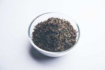 Black Tea Powder or dry dust with or without green leaf and served hot chai in a cup