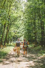 Fototapeta premium Hunting mushrooms in the forest