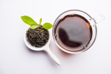 Black Tea Powder or dry dust with or without green leaf and served hot chai in a cup