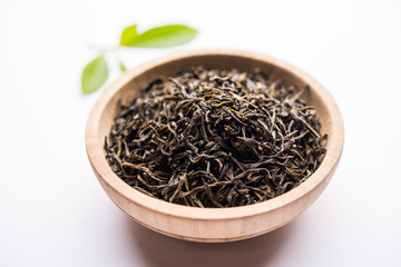 Black Tea Powder or dry dust with or without green leaf and served hot chai in a cup