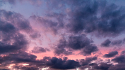 Naklejka na ściany i meble Colorful dramatic clouds at sunset