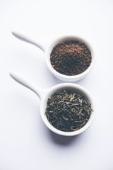 Black Tea Powder or dry dust with or without green leaf and served hot chai in a cup