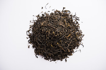 Black Tea Powder or dry dust with or without green leaf and served hot chai in a cup
