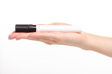 Black marker in hand on a white background. Isolation