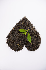 Black Tea Powder or dry dust with or without green leaf and served hot chai in a cup
