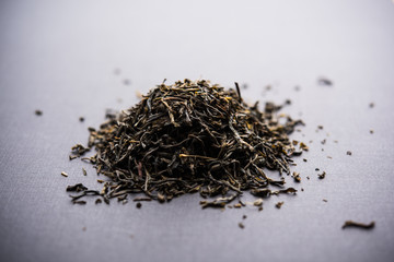 Black Tea Powder or dry dust with or without green leaf and served hot chai in a cup