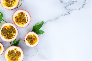 sliced passion fruit on marle background.
