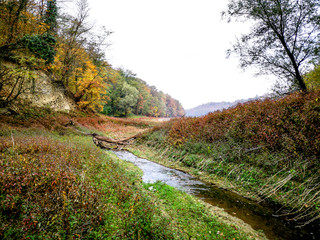 Small river surrounded with forest. Beautiful autumn colors. The environment of Kragujevac city in Serbia.