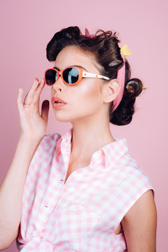 Pin up girl. happy girl in summer glasses. beauty salon and hairdresser. vintage housewife woman make hairstyle. retro woman with fashion makeup. Glamour fashion model. Young expertise
