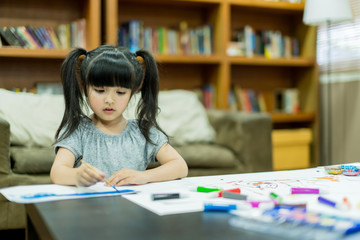 cheerful girl kid enjoy color painting with creativity ideas present and messy hand at home