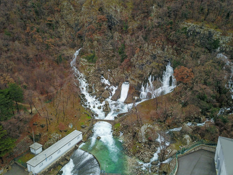 Hubelj Spring (Izvir Hubelj) below Trnovski gozd in Ajdovščina, Slovenia, is a big karst spring below rock wall. During high waters, there are a number of waterfalls emerging from a rock wall.  