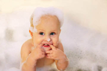 Baby Girl Taking Bubble Bath and Teething on her Fingers