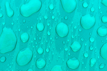 Drops of water on a green background, texture