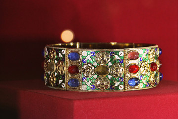 Old jewelry on red background