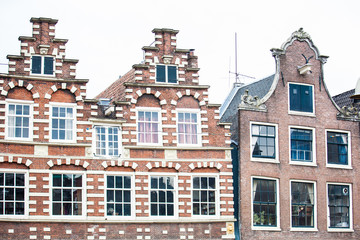 Fototapeta na wymiar Traditional buildings at the Old Central district of Amsterdam