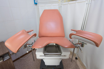 Gynecological cabinet with chair and other medical equipment in modern clinic