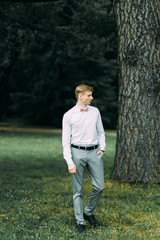 Stylish modern groom before the wedding. Portrait of a man in a suit.