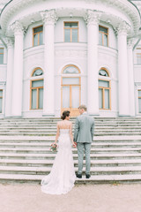 Stylish wedding in St. Petersburg. Russian wedding in the European style in the city. The castle and the architecture curve for the photo shoot.