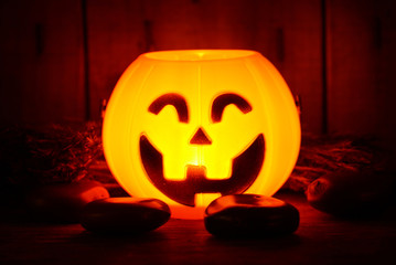 Fototapeta premium Light growing on pumpkin smile decorate for halloween night have space for idea