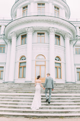Stylish wedding in St. Petersburg. Russian wedding in the European style in the city. The castle and the architecture curve for the photo shoot.