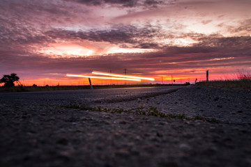 Sunset next of Street with Car lights Long Exposure Photo