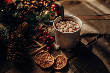Christmas decorations near hot chocolate and spices
